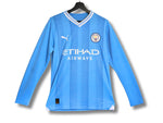 Maillot Manchester City domicile 2023/2024 bleu ciel, manches longues, version authentique, vue de face.