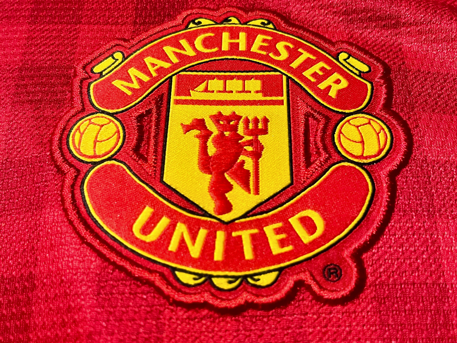 Écusson Manchester United et logo Nike sur motif Gingham